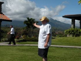 Boquete man pointing to mountains and clouds – Best Places In The World To Retire – International Living